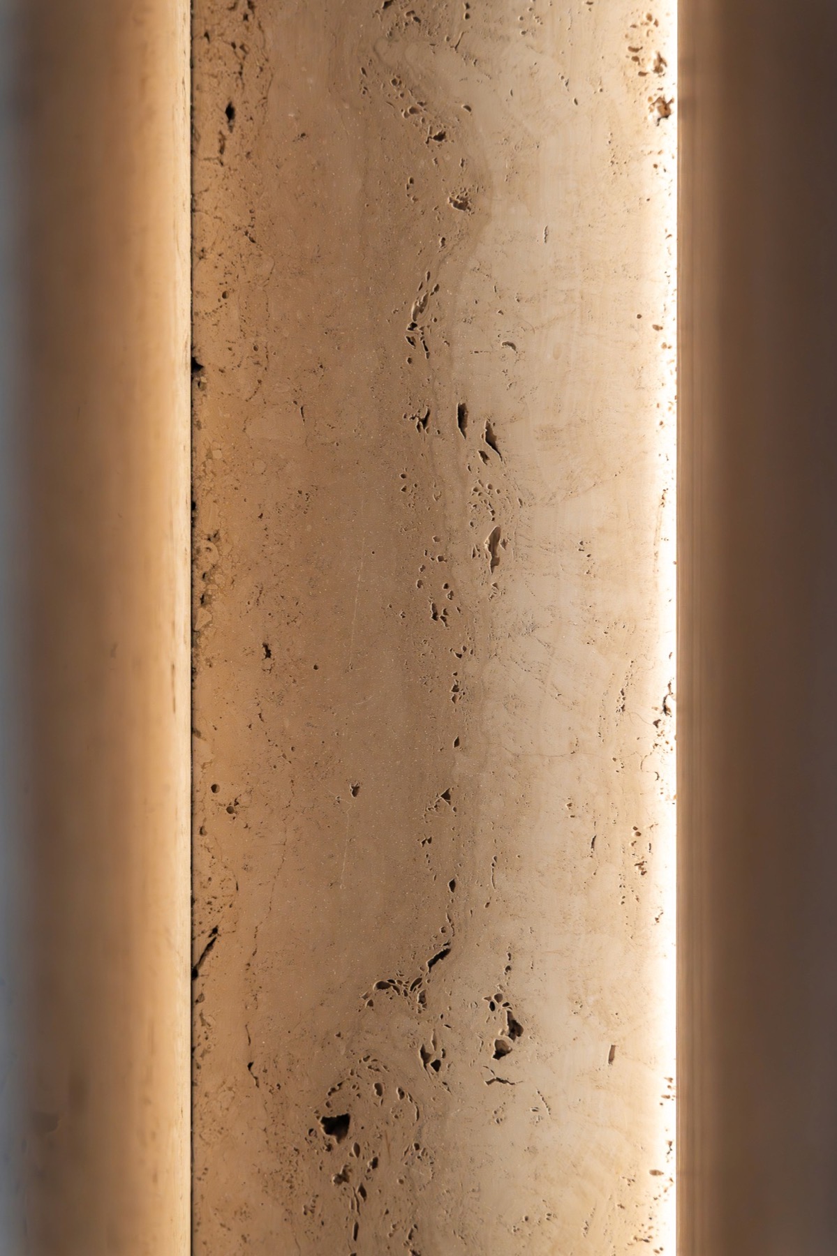 Backlit travertine column