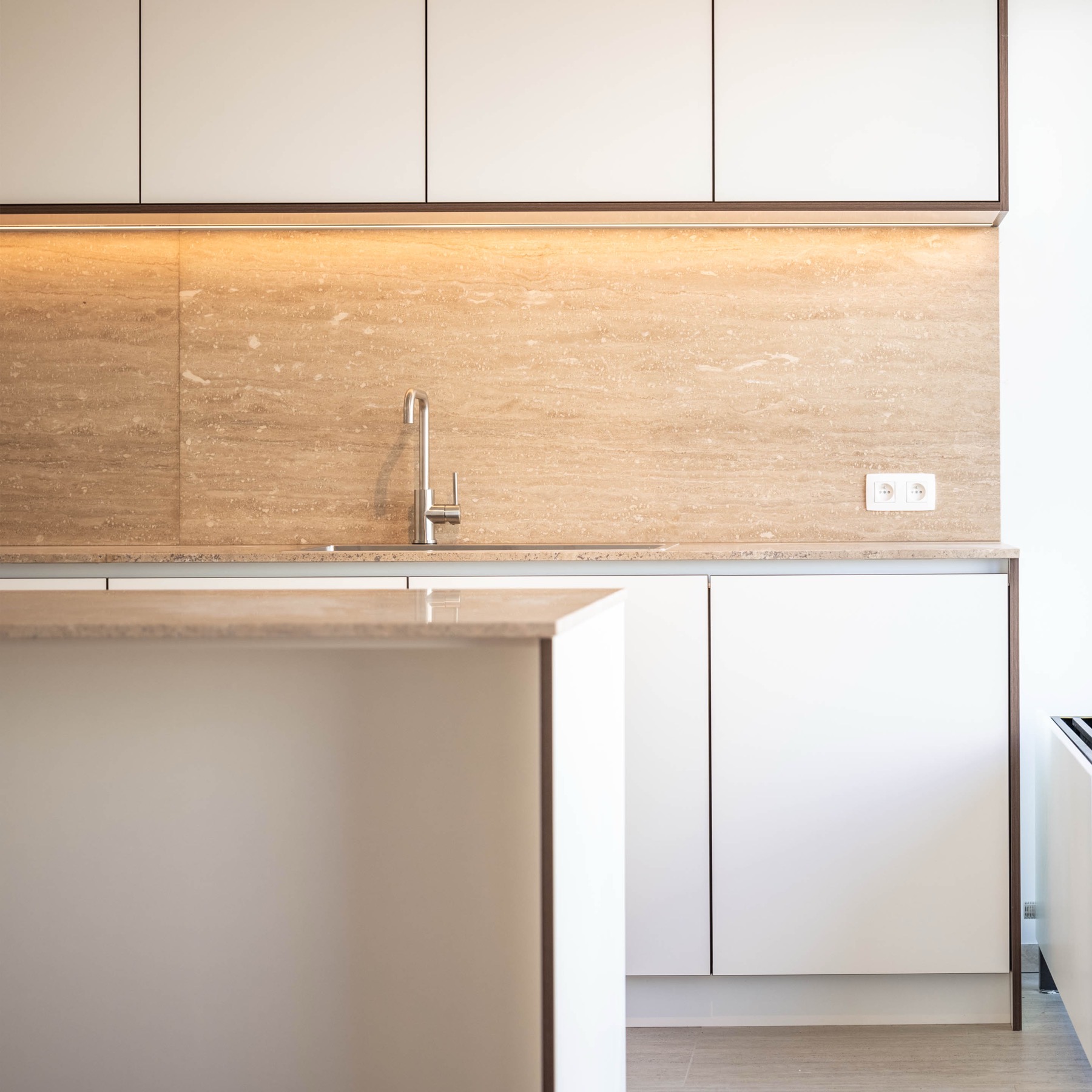 Kitchen with travertine backsplash